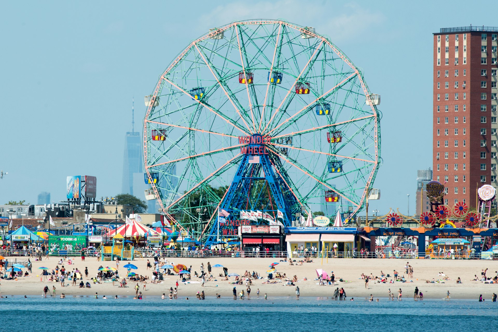 The Wonder Wheel and busy beach at Coney Island, New York, as seen from the water